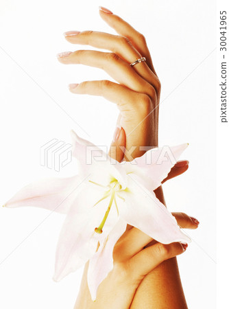 beauty delicate hands with manicure holding flower 30041965
