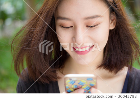 thai adult student beautiful girl us smart phone thai adult student beautiful girl us smart phone 30043788