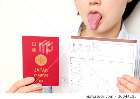 A woman with a passport and marriage notification A woman with a passport and marriage notification 30044185