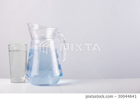 glass jug with water isolated on white background glass jug with water isolated on white background 30044641