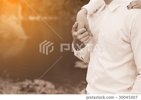 Couple holding hand in the park 30045807