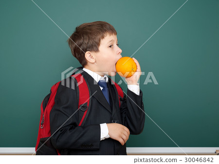 school boy on blackboard, education concept  30046842