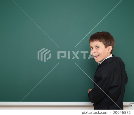 school boy on blackboard, education concept  30046875