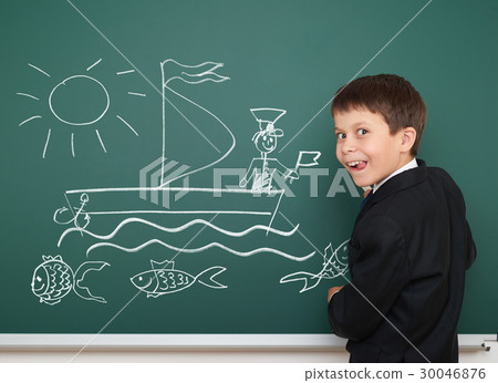 school boy on blackboard, education concept  30046876