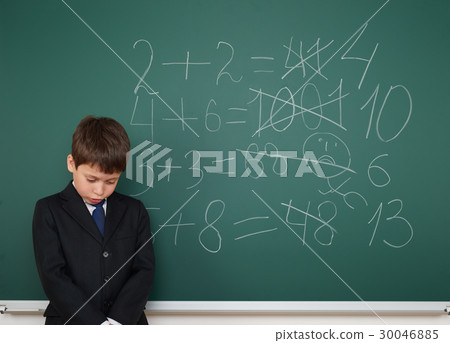 school boy on blackboard, education concept  30046885