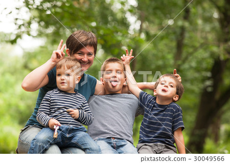 Mother with sons outdoors Mother with sons outdoors 30049566