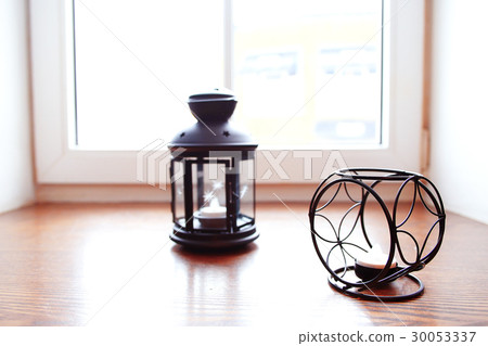 Candle in the candlestick on the windowsill Candle in the candlestick on the windowsill 30053337