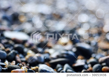 Pebble texture on the river bank 30053436