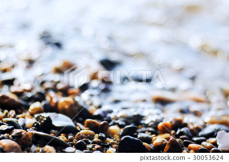Pebble texture on the river bank 30053624