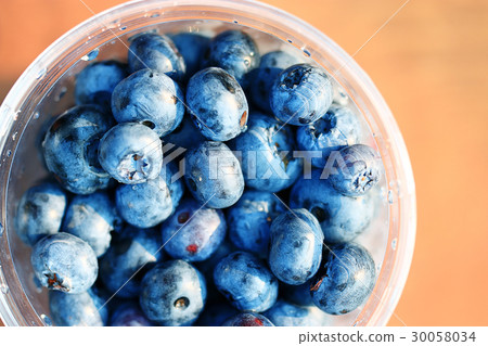 fresh berries blueberries close-up scattered fresh berries blueberries close-up scattered 30058034