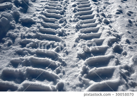 Footprints in the snow from the car Footprints in the snow from the car 30058070