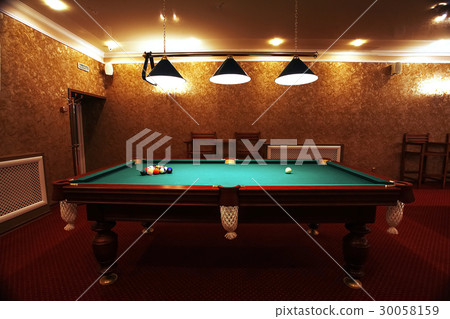 Large room with pool tables 30058159