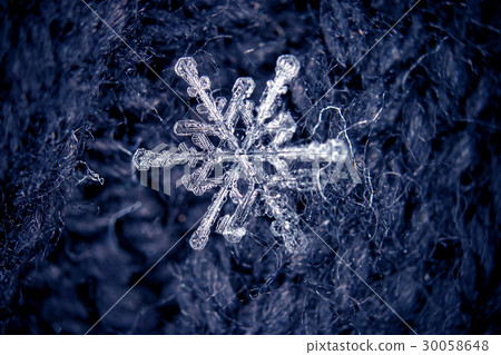 Snowflakes on the background of gray wool Snowflakes on the background of gray wool 30058648