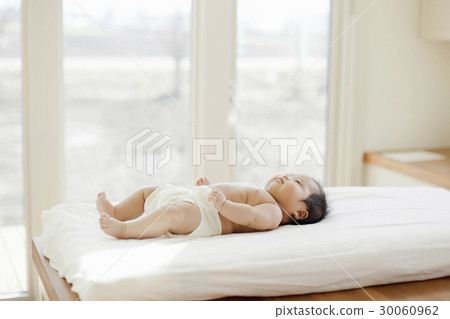 Infant on his back 30060962