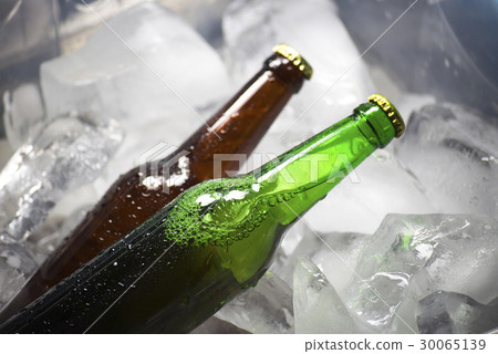 Bottles of beer on ice 30065139