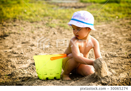 Cute little girl playing with sand 30065274