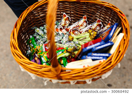 Basket full of chocolates and candies 30068492