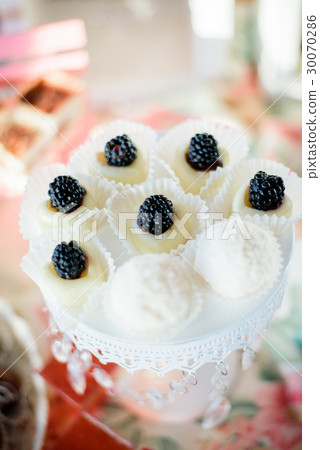 Little tasty white cakes decorated Little tasty white cakes decorated 30070286