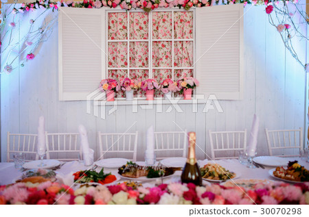 Decorative cosy white window with pink flowerpots Decorative cosy white window with pink flowerpots 30070298