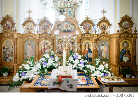 Bible in golde cover lies on table Bible in golde cover lies on table 30070395