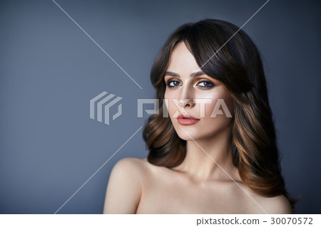 Beautiful woman portrait with long hair on dark background Beautiful woman portrait with long hair on dark background 30070572