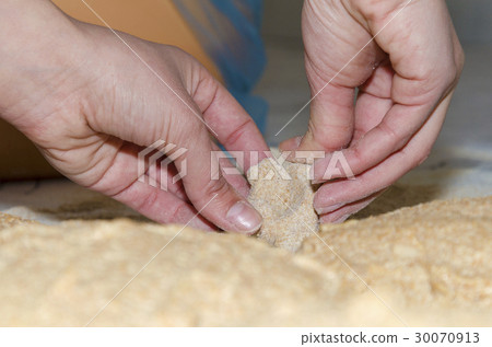 Kneading a dough from Einkorn wheat in a bakery 30070913
