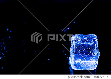 Blue ice cubes on black wet table. Blue ice cubes on black wet table. 30072393