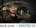 Portrait of the soldier with the gun in hands 30078210