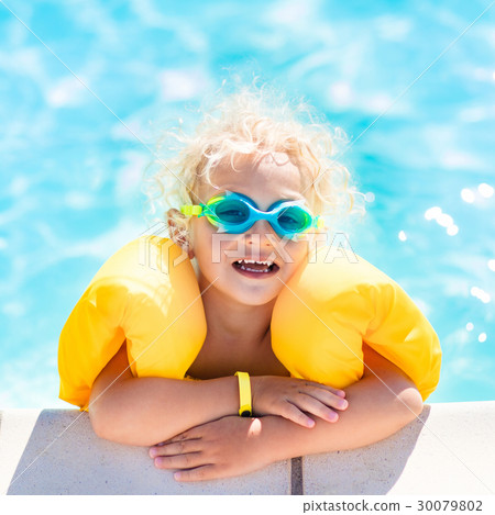 Little baby boy playing in swimming pool Little baby boy playing in swimming pool 30079802