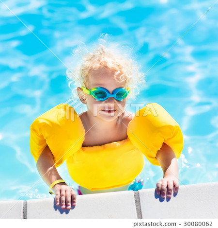 Little baby boy playing in swimming pool Little baby boy playing in swimming pool 30080062