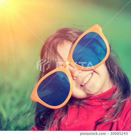 Happy little girl with big sunglasses Happy little girl with big sunglasses 30085243