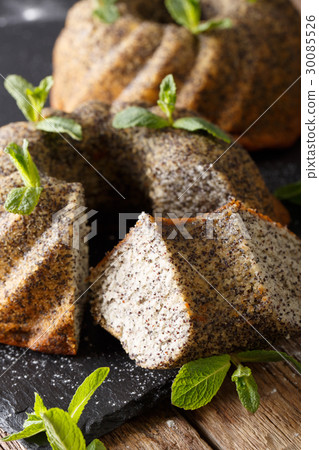 Delicious pound cake with poppy and mint macro Delicious pound cake with poppy and mint macro 30085526