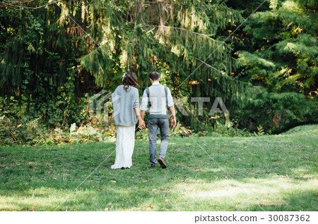 happy couple walking in summer park happy couple walking in summer park 30087362
