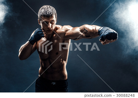Muscular topless fighter in boxing gloves Muscular topless fighter in boxing gloves 30088248