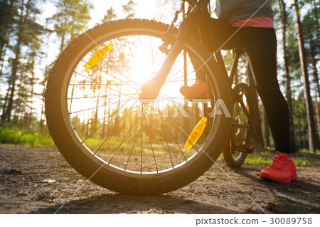 Woman riding a mountain bicycle 30089758
