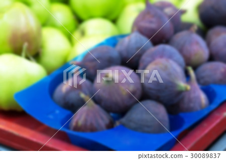 Ripe figs on street market, blurred Ripe figs on street market, blurred 30089837