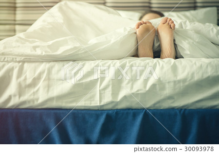 Female legs under blanket at sunset 30093978