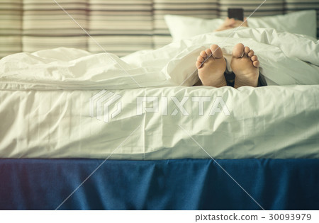 Female legs under blanket at sunset 30093979