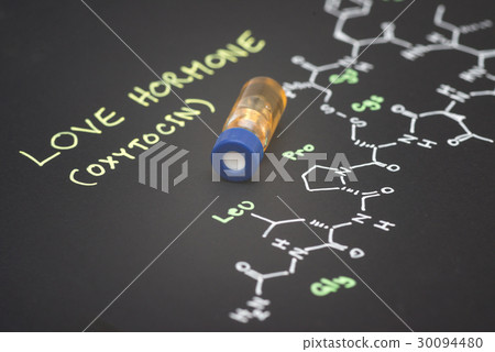 Close-up blue cap sample vial on paper  30094480