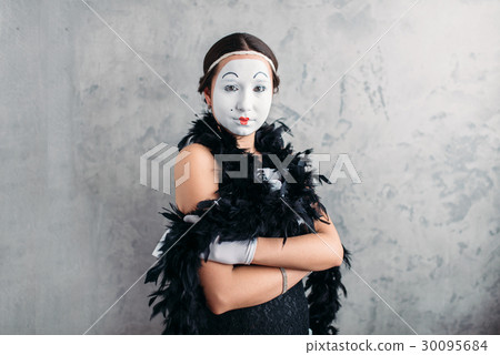 Pantomime actress with makeup posing in studio 30095684