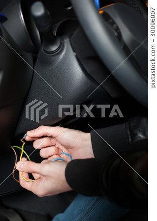 Male car thief breaks the ignition switch 30096007