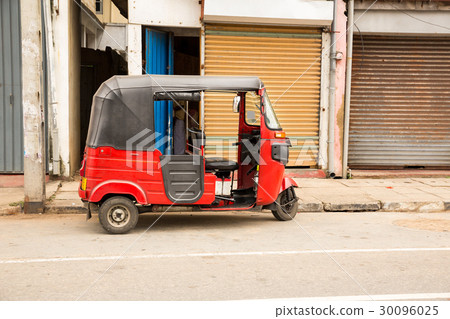 Tuk-tuk on road of Sri Lanka, side view 30096025