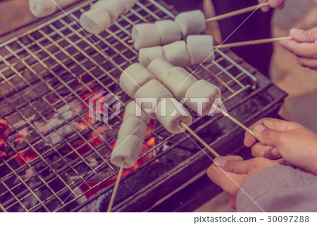 grilled marshmallow on hot coal. grilled marshmallow on hot coal. 30097288