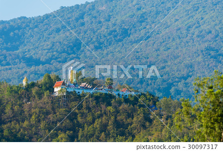 holy Buddha statue on mountain . 30097317