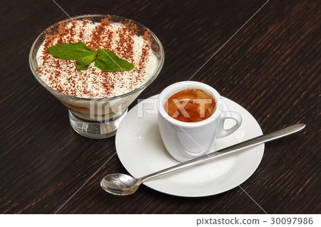 Tiramisu cake dessert in glass with mint leaves 30097986