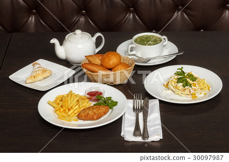 Tasty food, complex lunch on wooden table 30097987
