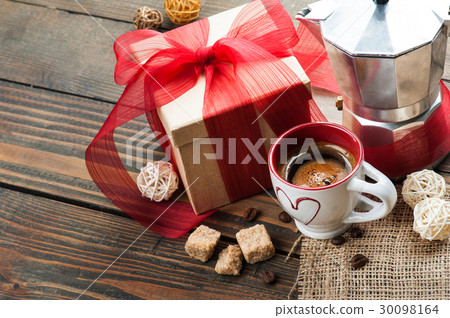 cup of coffee, gift with red ribbon, brown sugar cup of coffee, gift with red ribbon, brown sugar 30098164