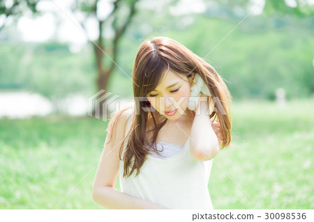 A woman who sweeps away 30098536