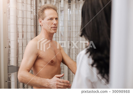 Attentive handsome man enjoying conversation with Attentive handsome man enjoying conversation with 30098988