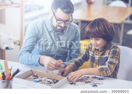 Little boy and his father playing in family circle 30099003
